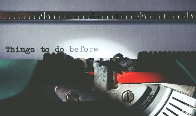Close-up of a vintage typewriter typing 'Things to do before'.